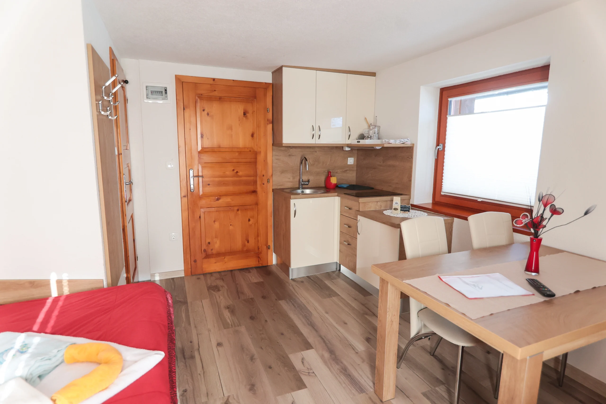 Kitchenette and dining area inside the Planika apartment.